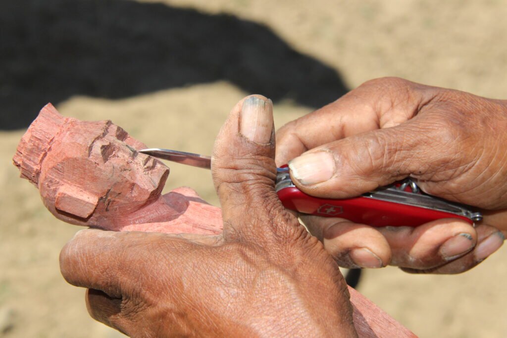 Carving in Wologai Village